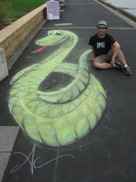 This is Adam Celeban and his happy smiling snake.